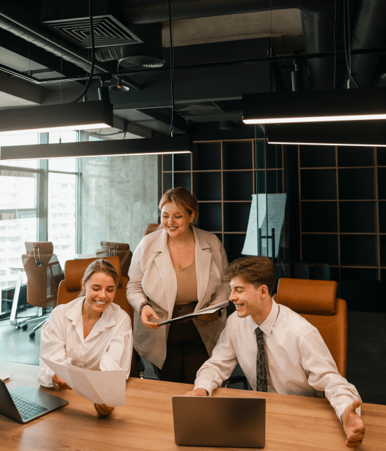 young-dark-haired-businesswoman-wearing-striped-shirt-is-sitting-her-office-looking-into-laptop-her-notebook-pencil-are-lying-desk-bright-modern-office 1 (1)-min